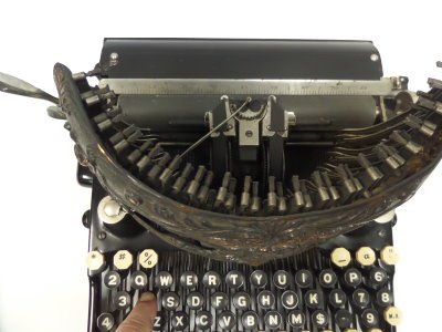 Bar-Lock typebar as it strikes the platen